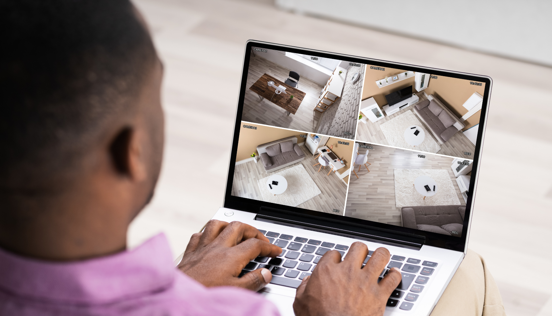 Installer testing CCTV camera footage and adjusting camera angles
